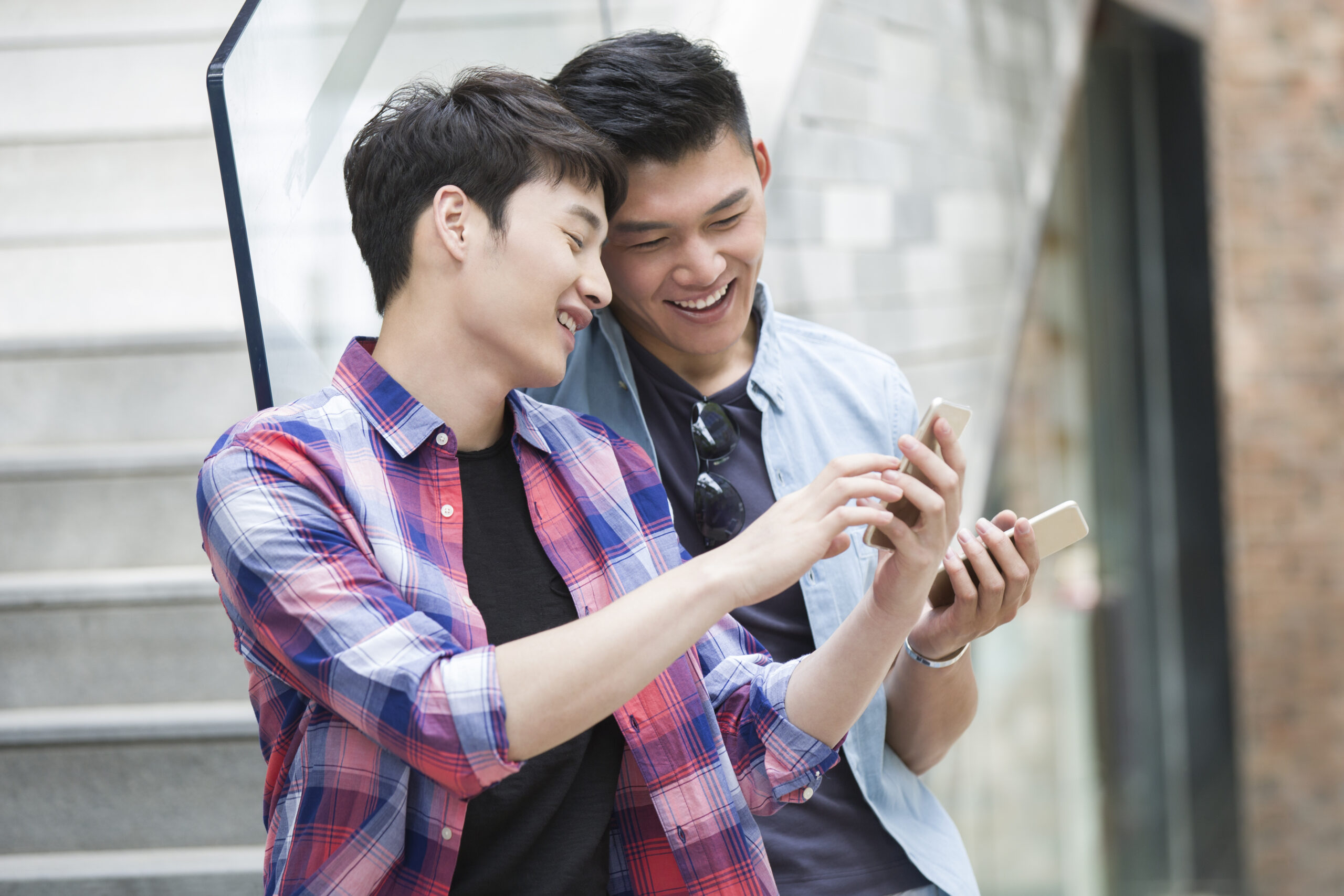 Group of people looking at smartphone using network phone system